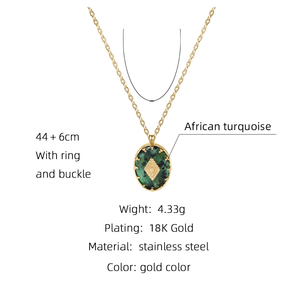 African turquoise pendant necklace with 18K gold plating. The pendant is oval-shaped, with a green gemstone inlaid and a diamond-shaped gold accent in the center. Chain length is 44 + 6 cm, with ring and buckle clasp. The necklace weighs 4.33 grams and is made of stainless steel with gold color