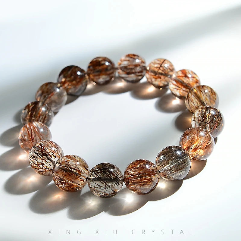 This healing bracelet with smoky brown crystals is designed to support calm and clarity, making it a stylish and soothing accessory.