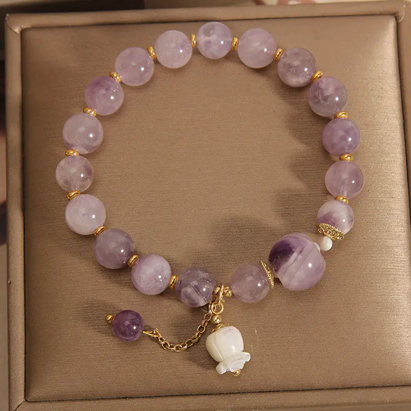 This purple gemstone bracelet is crafted to support healing and well-being, featuring premium stones believed to inspire balance and inner peace.