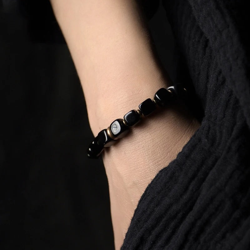 Crafted with black aura crystals, this mystical bracelet is believed to enhance clarity and intuition, ideal for those seeking both style and spiritual benefits.