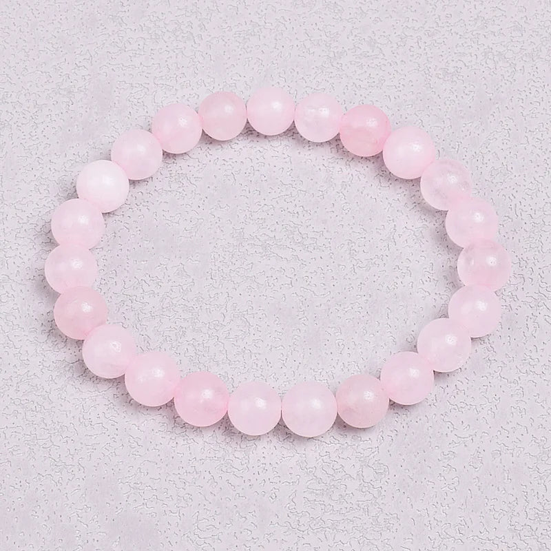 A beautiful aura quartz bracelet in shades of pink, believed to enhance self-love and confidence, perfect for those who seek a touch of magic in their jewelry.