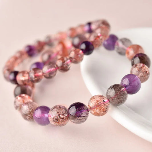 A mystical purple aura crystal bracelet that brings elegance and a hint of magic to your collection. Known for enhancing intuition and inner strength