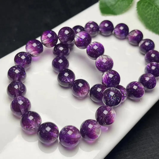 A handcrafted beaded bracelet featuring rich purple crystals, perfect for those who appreciate unique, artisan jewelry.